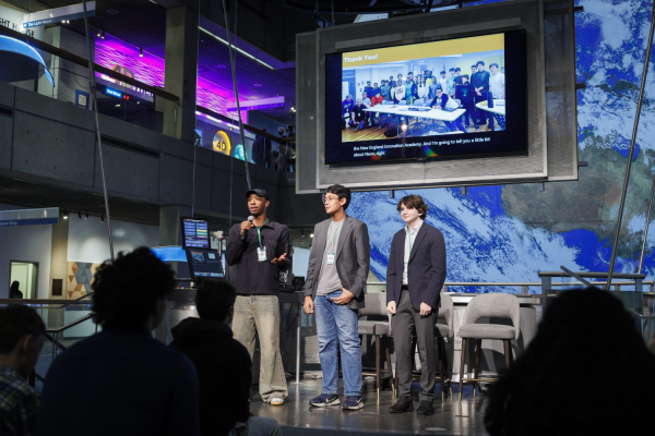 Langston Reid, Vishnu Bharath, and Simon Zall (left to right) discuss their project at the 2024 Day of AI global celebration at the Museum of Science. Day of AI is a free, hands-on curriculum developed by the MIT Responsible AI for Social Empowerment and Education (RAISE) initiative.