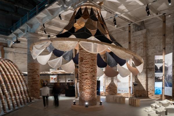 VAMO (Vegetal, Animal, Mineral, Other), is an ultra-lightweight, biodegradable, and transportable canopy designed to circle around a brick column in the Corderie of the Venice Arsenale — a historic space originally used to manufacture ropes for the city’s naval fleet.