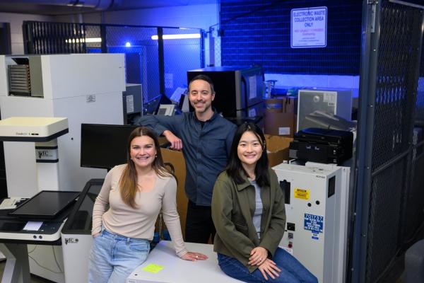 Left to right: Anastasia Duncan, Chris Rabe, and Jasmin Liu stand at the loading dock of MIT's Stata Center, where students and faculty go "crufting." Rabe facilitated an interdisciplinary working group of undergraduate and graduate students known as SERC Scholars to co-author a case study on the electronic hardware waste life cycle and climate justice.