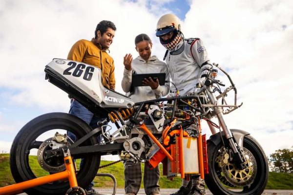 Electric Vehicle Team members (from left to right) Anand John, Rachel Mohammed, and Aditya Mehrotra '22, SM '24 monitor their bike’s performance, battery levels, and hydrogen tank levels to estimate the vehicle’s range.