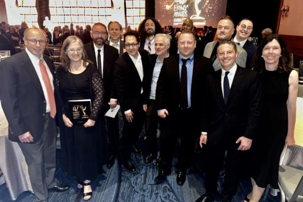 MIT Video Productions team at the 47th Boston/New England Emmy Awards Ceremony. Front row, left to right: Rod Lindheim, Dawn Morton, Clayton Hainsworth, Mujtaba Jamali, Jean Dunoyer, Alexander Sachs, Christopher Capozzola, and Brigitte Tersek. Back row, left to right: Frederick Harris, Myles Lowery, Wesley Richardson, Barry Pugatch, and TJ Saccoccio.